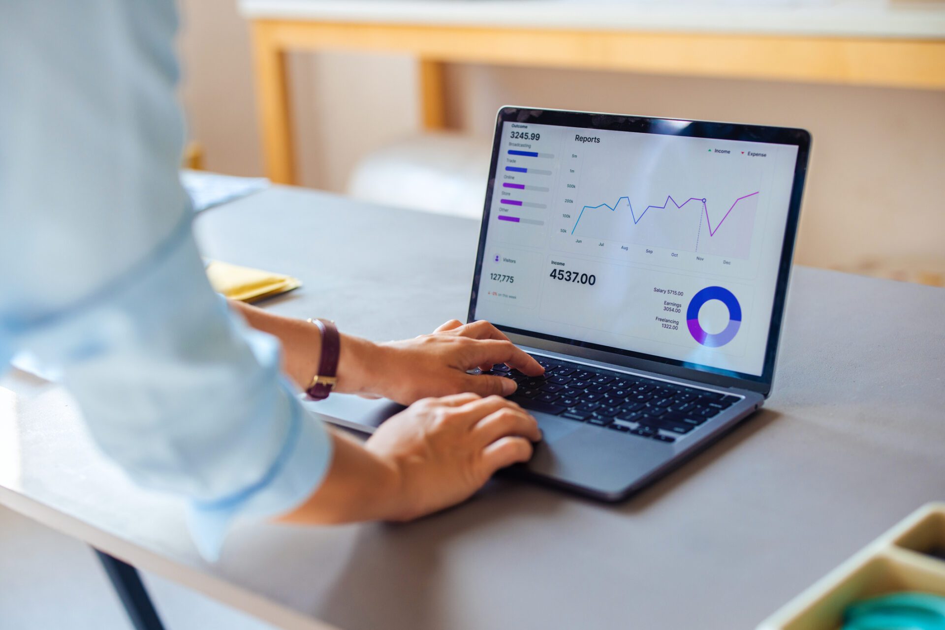 Business Professional Analyzing Financial Data on Laptop NWI PPC Services