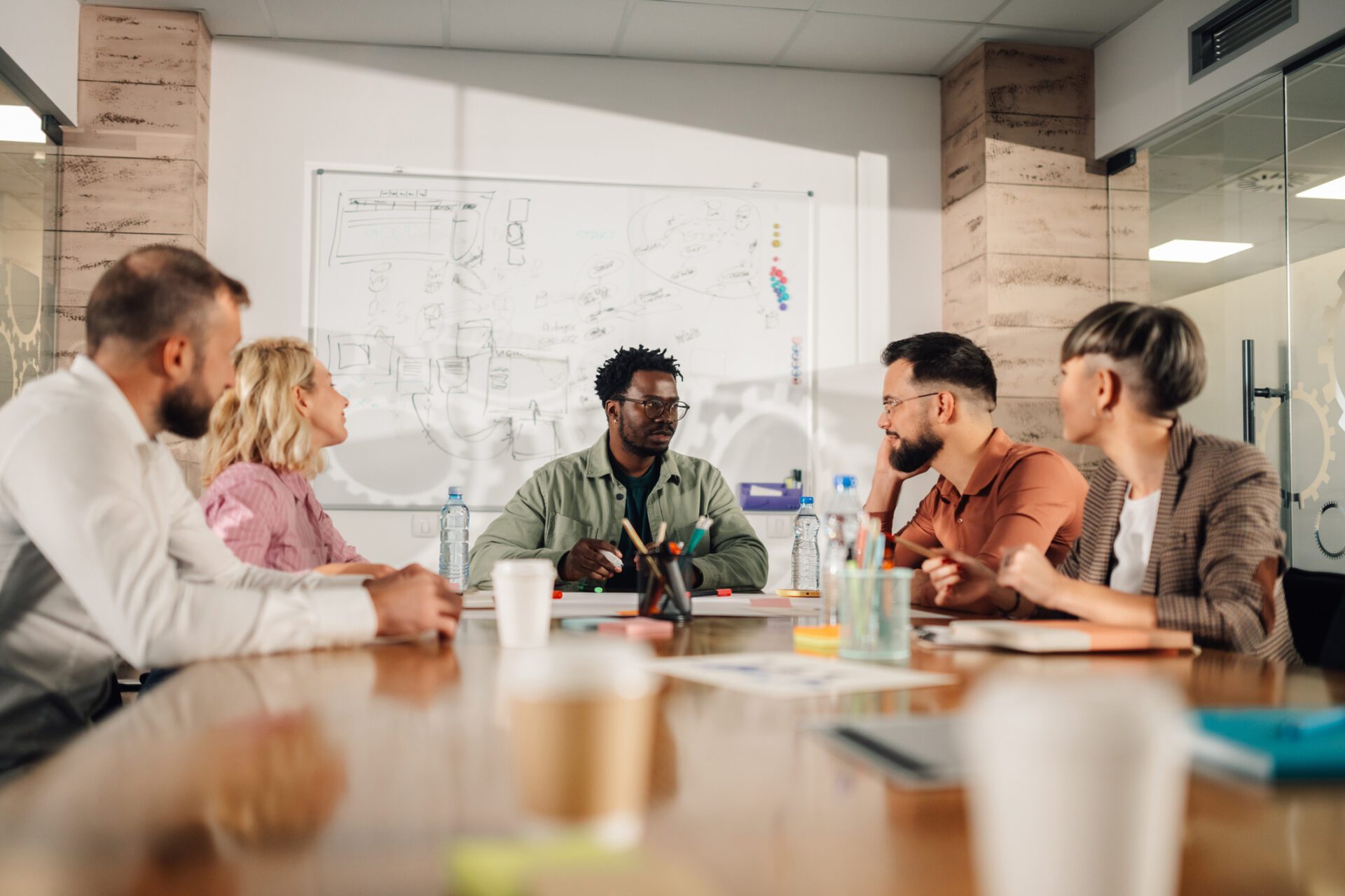 Marketing professionals collaborating on project during meeting in modern office Search Engine Optimization Services in NWI